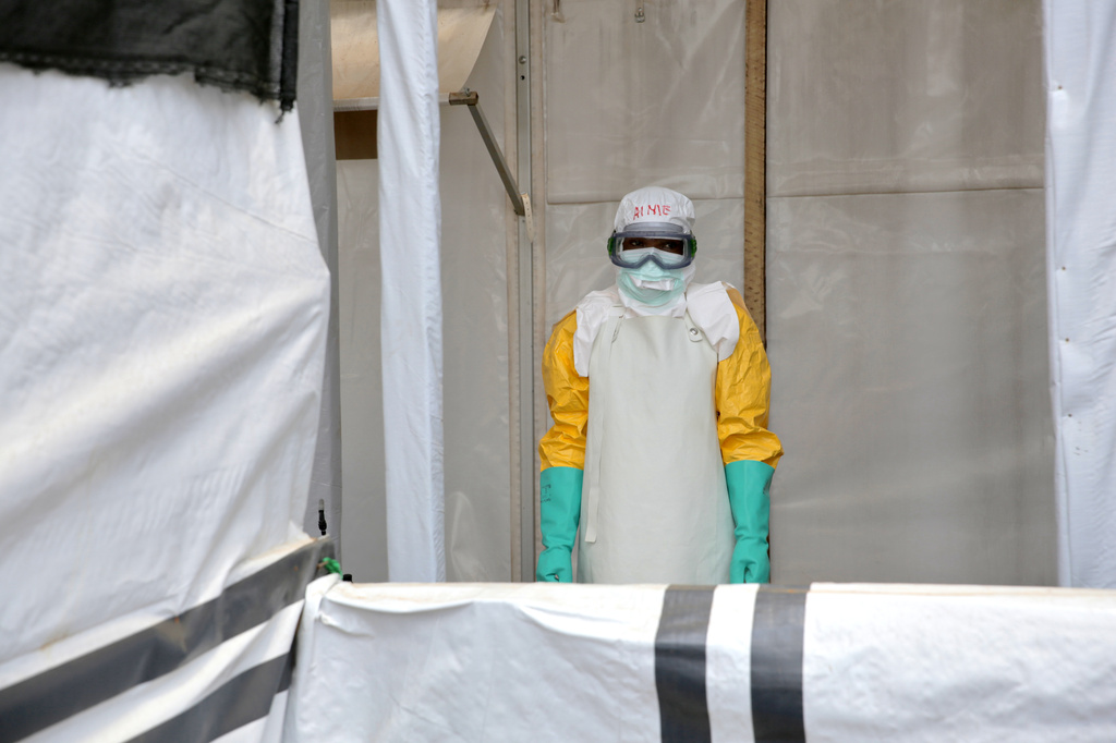 A health worker pauses after disinfecting a treatment center for Ebola patients, in Beni, North Kivu province, eastern Congo, Monday, Aug. 31, 2026. (AP Photo/Sebastien Kitsa Musayi)