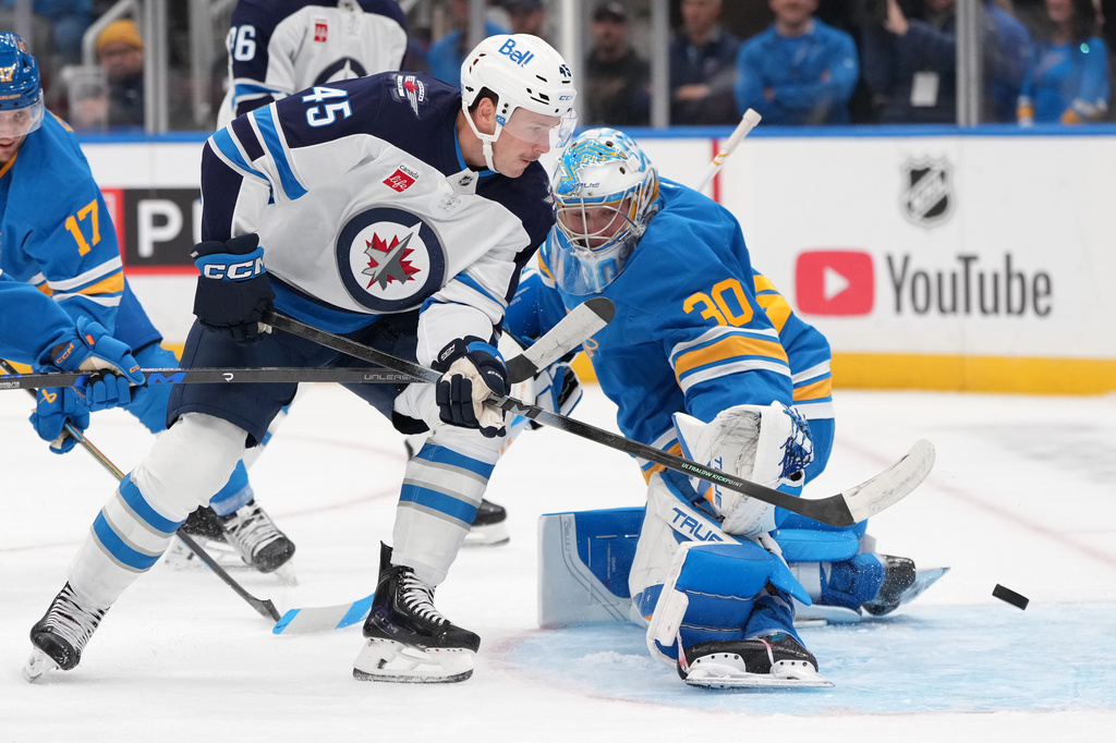 Winnipeg Jets' Cole Koepke (45) is unable to score past St. Louis Blues goaltender Joel Hofer (30) during the first period of an NHL hockey game Tuesday, Oct. 20, 2026, in St. Louis. (AP Photo/Jeff Roberson)