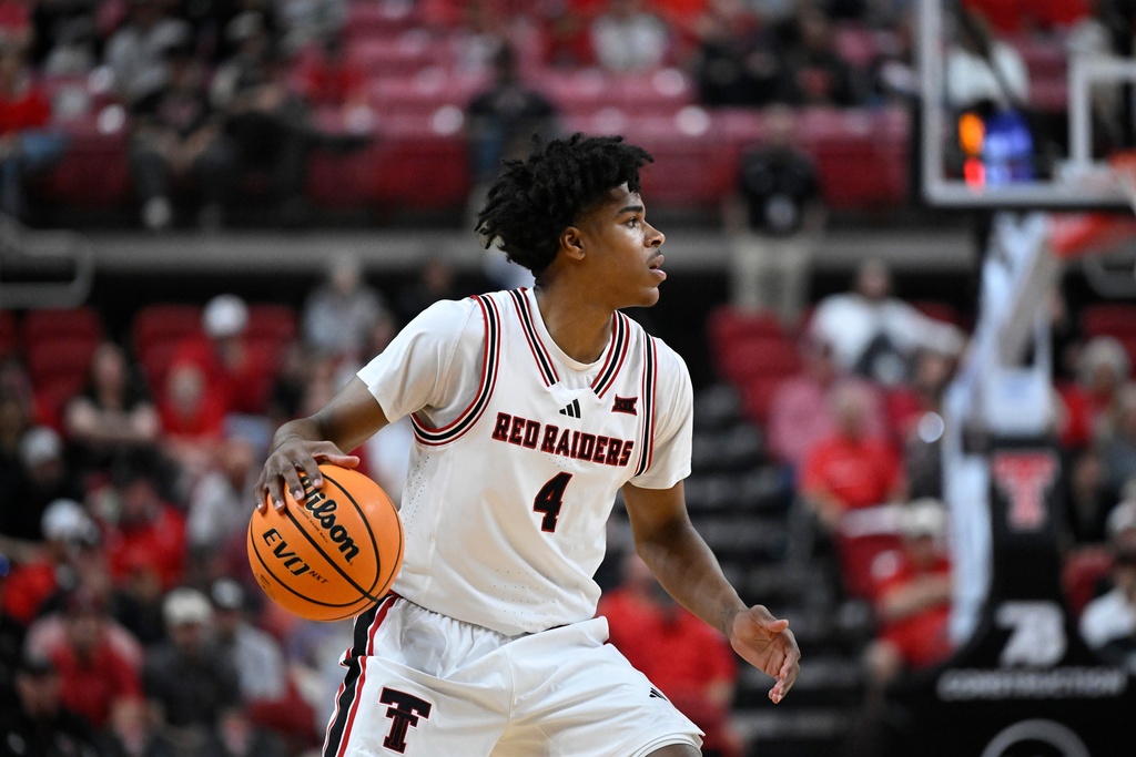 Texas Tech guard Christian Anderson (4) controls the ball during the first half of an NCAA college basketball game against Cincinnati, Tuesday, Feb. 24, 2026, in Lubbock, Texas. (AP Photo/Justin Rex)