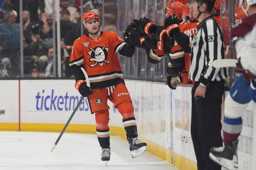 Anaheim Ducks left wing Cutter Gauthier, left, celebrates his goal with teammates during the second period of an NHL hockey game against the Colorado Avalanche Tuesday, March 3, 2026, in Anaheim, Calif. (AP Photo/Gregory Bull)