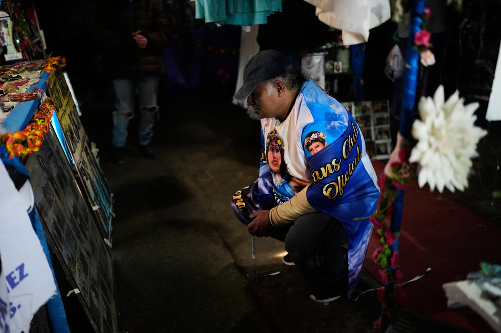 A man prays at a sanctuary dedicated to late Argentine singer Gilda on the 30th anniversary of her death in a bus crash, in Entre Rios, Argentina, Monday, Sept. 7, 2026. (AP Photo/Natacha Pisarenko)