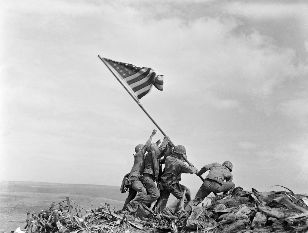FILE - U.S. Marines of the 28th Regiment, 5th Division, raise a U.S. flag atop Mount Suribachi, Iwo Jima, Japan, Feb. 23, 1945.(AP Photo/Joe Rosenthal, File)