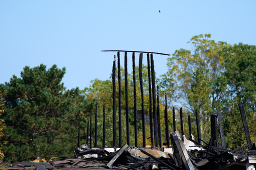 The Church of Jesus Christ of Latter-day Saints in Grand Blanc Township, Mich. is seen where Sunday morning a man rammed his vehicle into the building before opening fire and setting the building ablaze, Tuesday, Sept. 30, 2025. (AP Photo/Ryan Sun) The Church of Jesus Christ of Latter-day Saints in Grand Blanc Township, Mich. is seen where Sunday morning a man rammed his vehicle into the building before opening fire and setting the building ablaze, Tuesday, Sept. 30, 2025. (AP Photo/Ryan Sun)