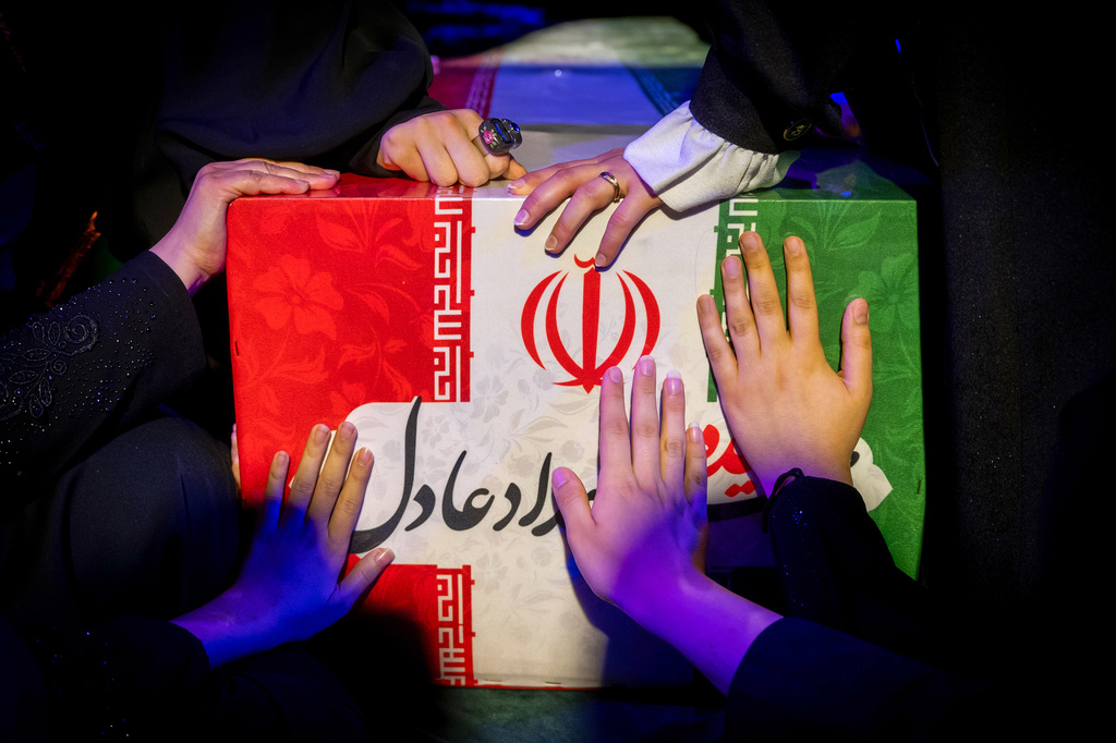Mourners touch the coffin of Zahra Haddad-Adel, daughter of former Iranian parliament speaker Gholam-Ali Haddad-Adel and wife of Iran's Supreme Leader Mojtaba Khamenei, during her funeral in Tehran, Thursday, July 2, 2026. According to Iranian authorities she was killed in the same strike that killed then-Supreme Leader Ali Khamenei.(Fars News Agency via AP)(Fars News Agency via AP)