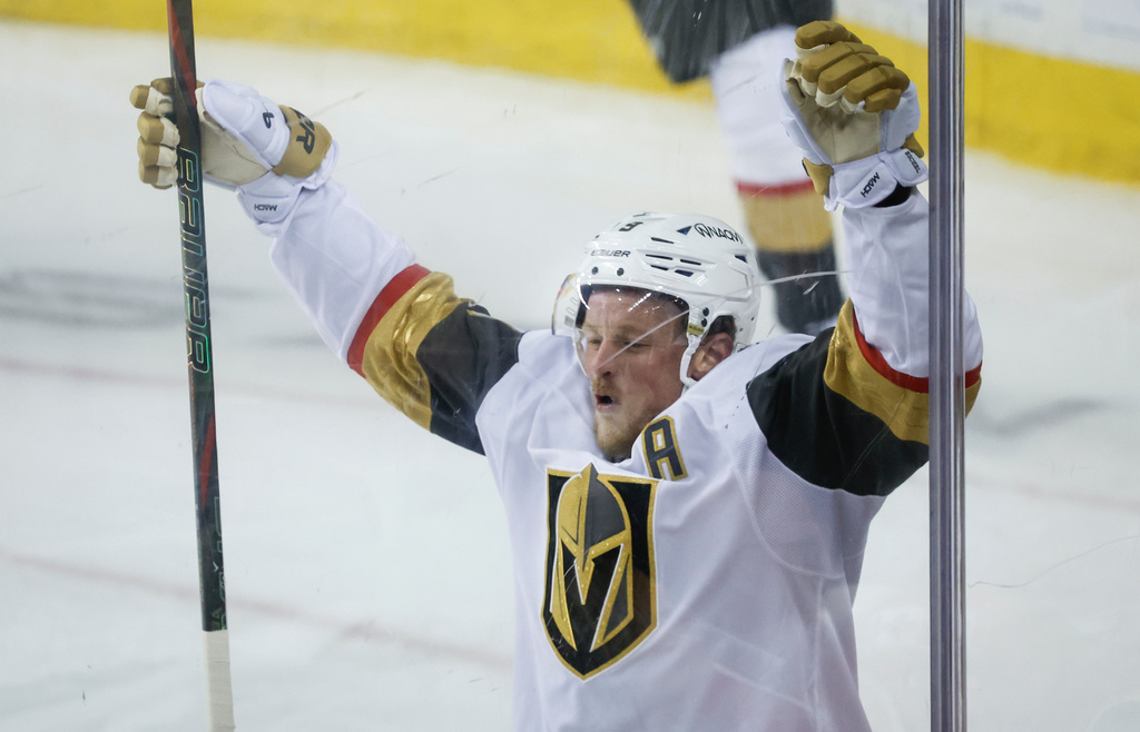 Vegas Golden Knights' Jack Eichel celebrates his goal during the third period of an NHL hockey game against the Calgary Flames in Calgary, Alberta, on Tuesday, Oct. 14, 2025. (Jeff McIntosh/The Canadian Press via AP)