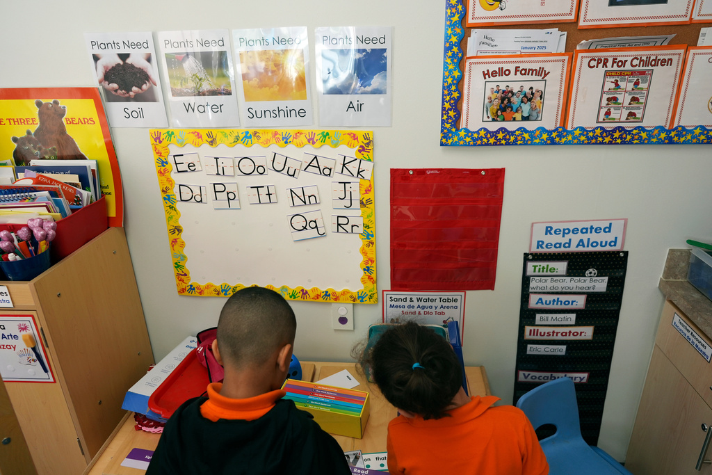 FILE - Students help put away supplies at the end of a reading and writing lesson at the Head Start program run by Easterseals, an organization that gets about a third of its funding from the federal government, Wednesday, Jan. 29, 2025, in Miami. (AP Photo/Rebecca Blackwell, File)