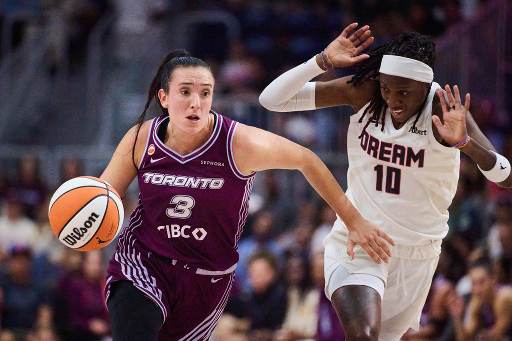 Toronto Tempo's Marina Mabrey (3) drives past Atlanta Dream's Rhyne Howard (10) during first half of a WNBA basketball game in Toronto, Friday, July 17, 2026. (Sammy Kogan/The Canadian Press via AP)