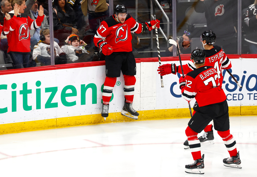New Jersey Devils left wing Paul Cotter (47) reacts after scoring a goal against the Boston Bruins during the third period of an NHL hockey game, Monday, March 16, 2026, in Newark, N.J. (AP Photo/Noah K. Murray)