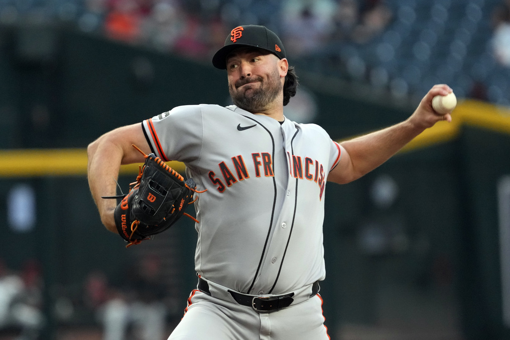 San Francisco Giants pitcher Robbie Ray throws against the Arizona Diamondbacks in the first inning of a baseball game, Monday, May 18, 2026, in Phoenix. (AP Photo/Rick Scuteri)