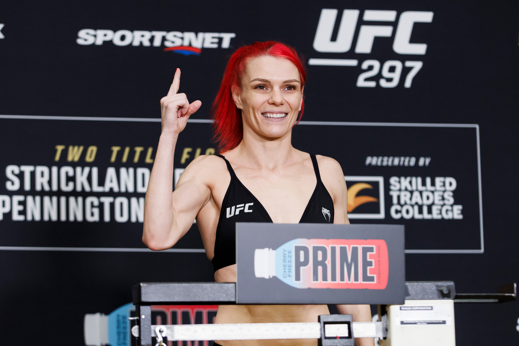 FILE - Gillian Robertson weighs in ahead of her UFC strawweight bout in Toronto Friday, Jan. 19, 2024. (Cole Burston/The Canadian Press via AP, file)