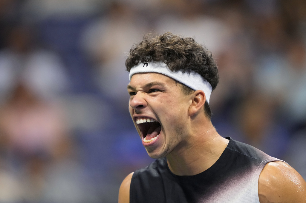Ben Shelton, of the United States, reacts during the men's singles semifinals of the U.S. Open tennis championships against Frances Tiafoe, of the United States, Friday, Sept. 11, 2026, in New York. (AP Photo/Yuki Iwamura)