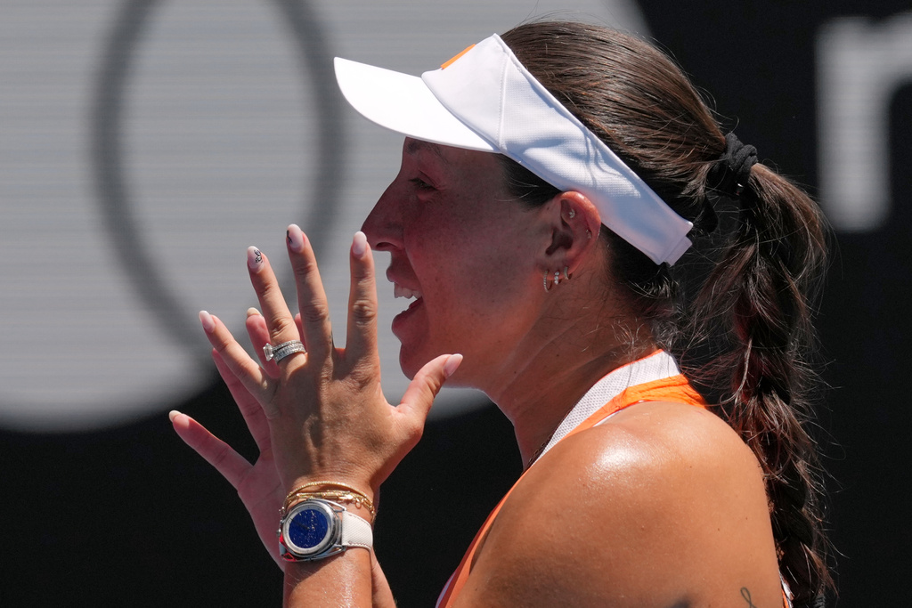 Jessica Pegula of the U.S. reacts after defeating her compatriot Madison Keys in their fourth round match at the Australian Open tennis championship in Melbourne, Australia, Monday, Jan. 26, 2026. (AP Photo/Mark Baker)