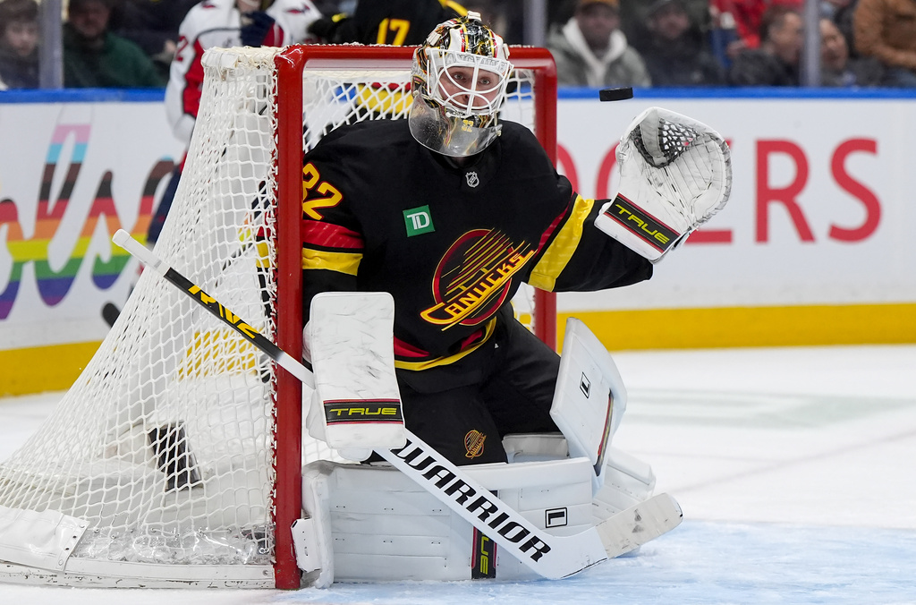 Vancouver Canucks goalie Kevin Lankinen watches the puck during the second period of an NHL hockey game against the Washington Capitals, in Vancouver, British Columbia, Wednesday, Jan. 21, 2026. (Darryl Dyck/The Canadian Press via AP)
