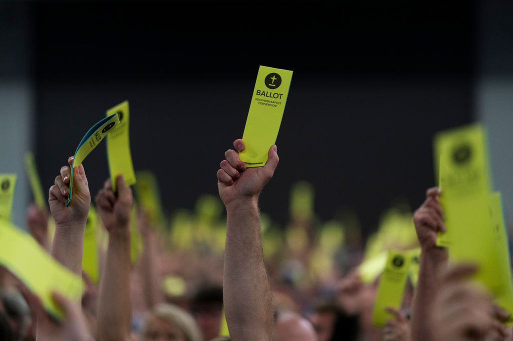 File - Attendees hold up their ballots during the Southern Baptist Convention's annual meeting in Anaheim, Calif., June 14, 2022. (AP Photo/Jae C. Hong, File)