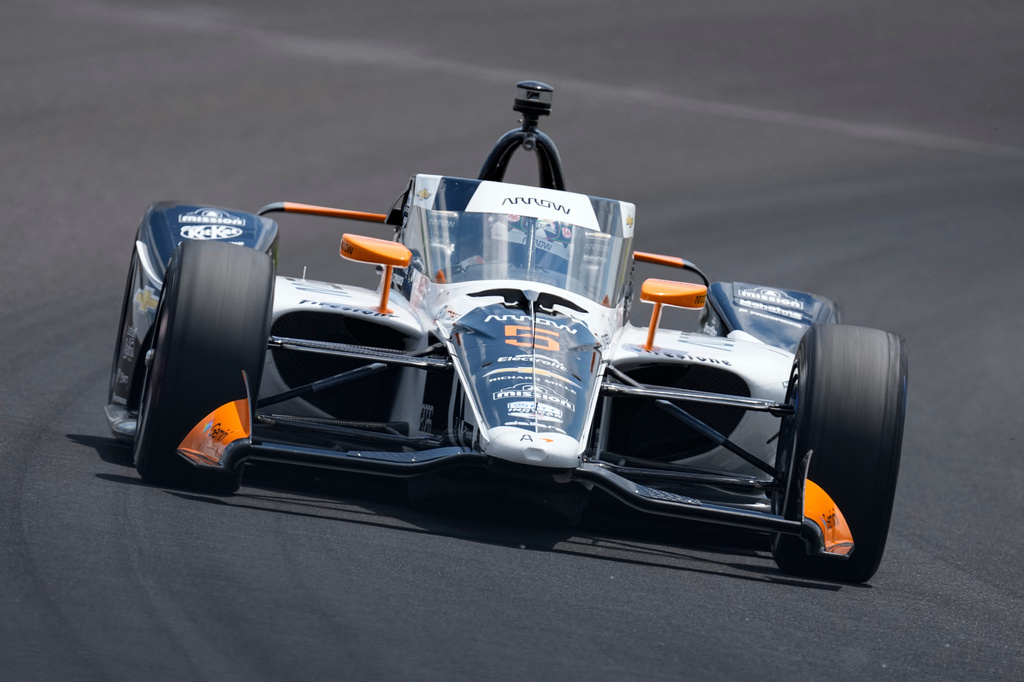 Pato O'Ward, of Mexico, drives through the third turn during qualifications for the Indianapolis 500 auto race at the Indianapolis Motor Speedway in Indianapolis, Sunday, May 17, 2026. (AP Photo/Michael Conroy)