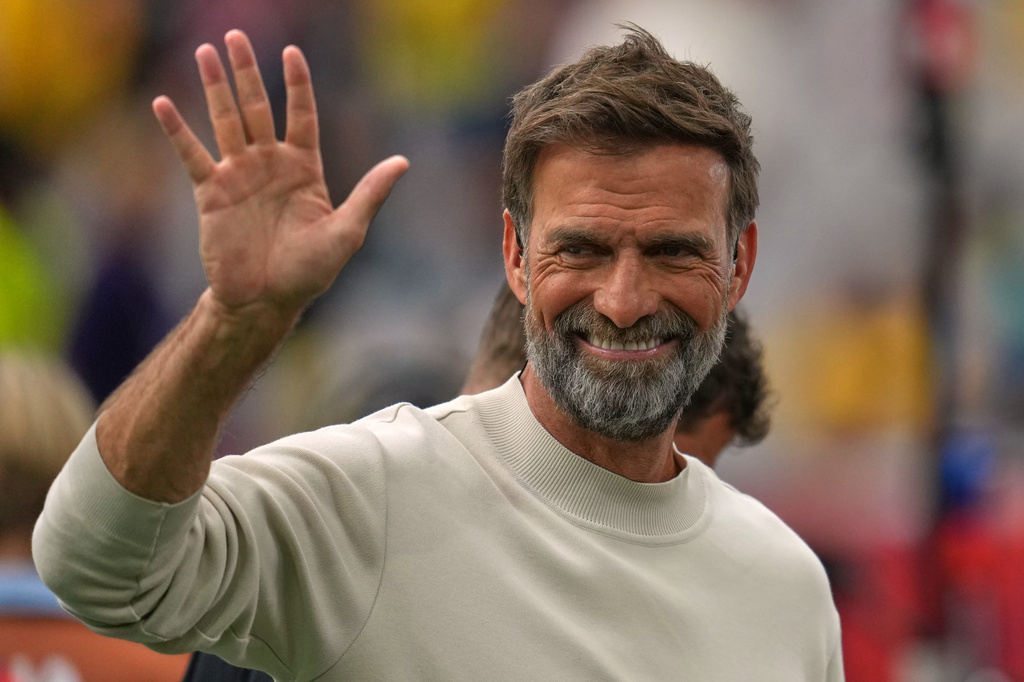 Former soccer coach Jurgen Klopp waves to fans during the World Cup round of 16 soccer match between Switzerland and Colombia in Vancouver, British Columbia, Tuesday, July 7, 2026. (AP Photo/Abbie Parr)