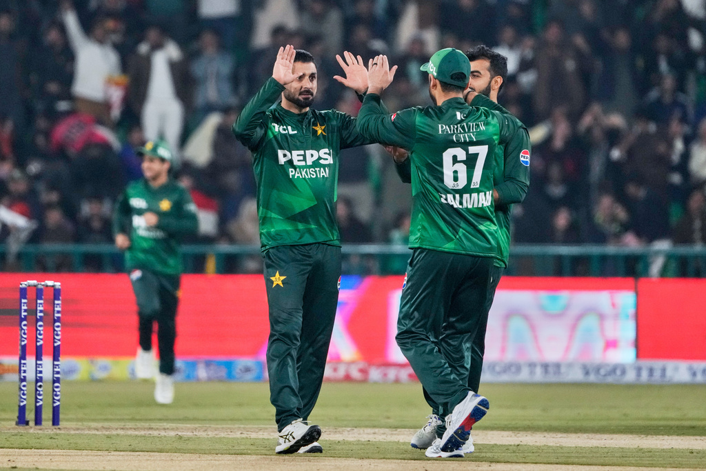 Pakistan's Abrar Ahmed, left, celebrates with teammates after the dismissal of Australia's Cooper Connolly during the first T20 cricket match between Pakistan and Australia, in Lahore, Pakistan, Thursday, Jan. 29, 2026. (AP Photo/K.M. Chaudary)