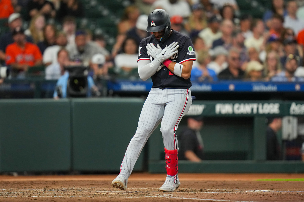 Minnesota Twins' Royce Lewis celebrates as he tags home after hitiing a solo home run during the fourth inning of a baseball game against the Houston Astros in Houston, Monday, June 29, 2026. (AP Photo/Jon Shapley)