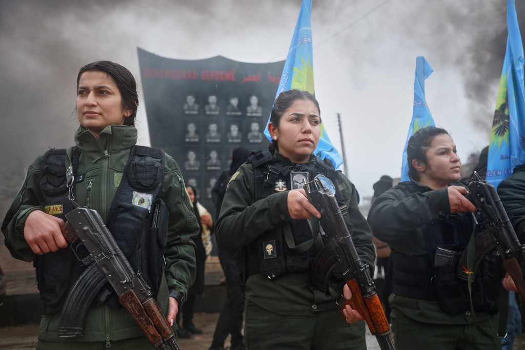 FILE - Female soldiers of the Kurdish-led, U.S.-backed Syrian Democratic Forces (SDF) march during a military parade in Qamishli, northeastern Syria, Sunday, Jan. 18, 2026. (AP Photo/Baderkhan Ahmad, File)
