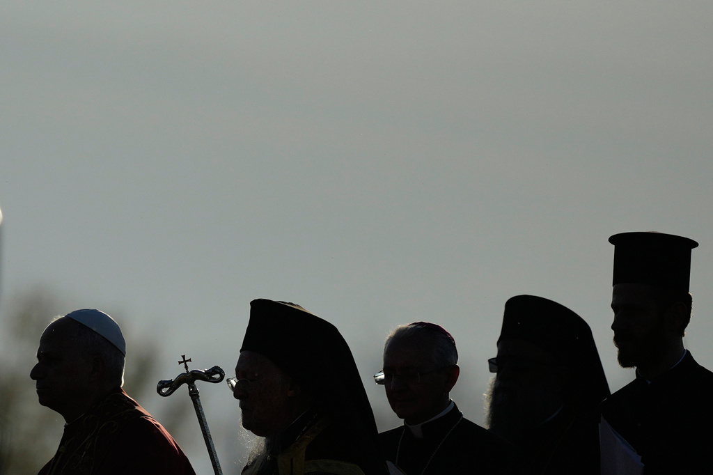 FILE - Pope Leo XIV, left, and Ecumenical Patriarch Bartholomew I, the spiritual leader of the world's Eastern Orthodox Christians, second left, leave after an Ecumenical prayer service at archaeological excavations of the ancient Byzantine-era Christian Saint Neophytos Basilica, in Iznik, Turkey, Nov. 28, 2025. (AP Photo/Khalil Hamra, File)
