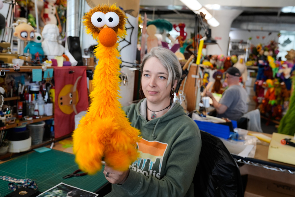 Sierra Schoening, a senior puppet builder, demonstrates how to maneuver a puppet she built at Jim Henson's Creature Shop in New York, Wednesday, May 13, 2026. (AP Photo/Seth Wenig)