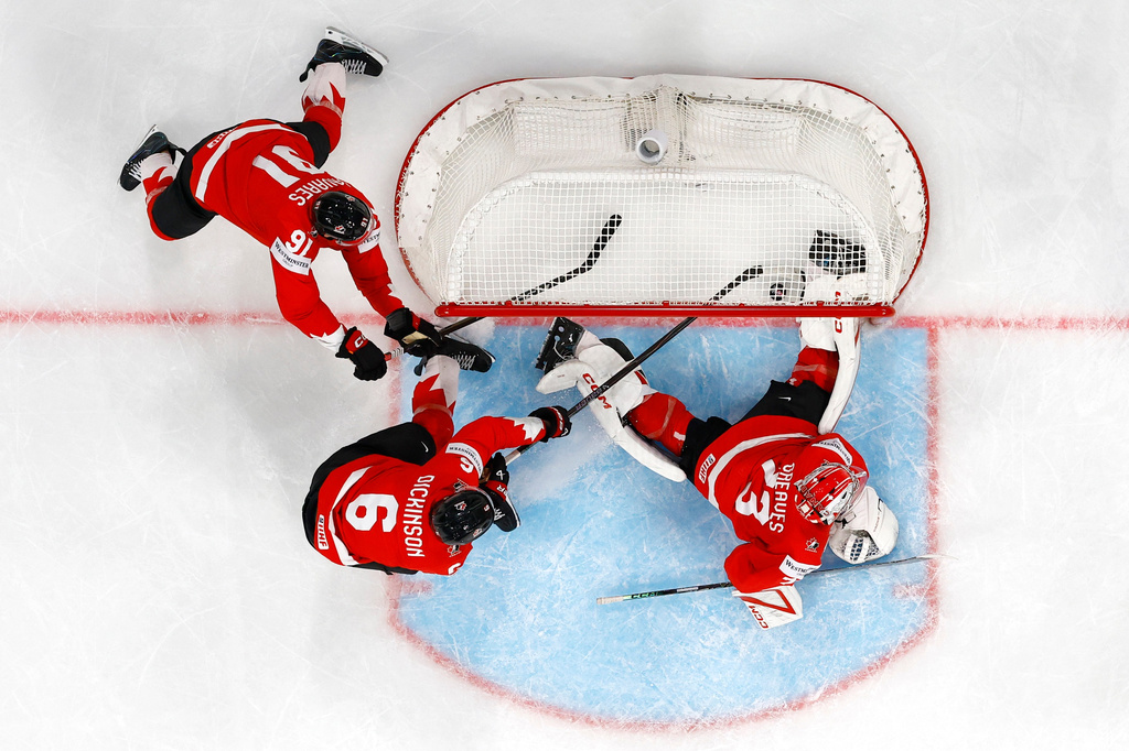 Canada's goaltender Jet Greaves, right, Sam Dickinson, center, and John Tavares concede a third goal during the semifinal game between Finland and Canada at the men's ice hockey world championship, Saturday, May 30, 2026, in Zurich, Switzerland. (Cyril Zingaro/Keystone via AP)