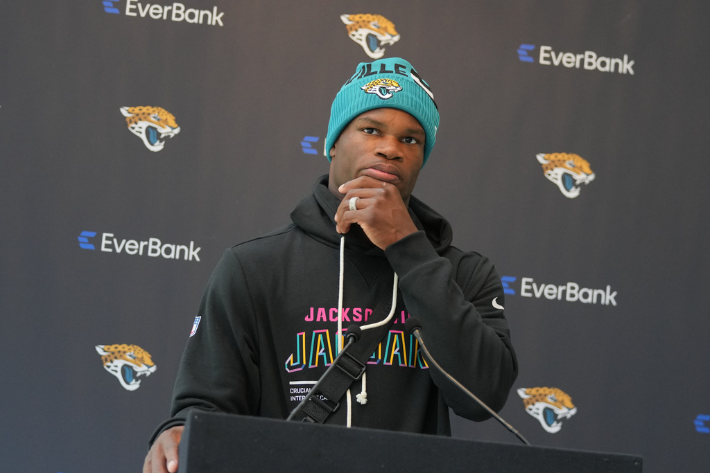 Jacksonville Jaguars wide receiver Travis Hunter speaks during a press conference at an NFL football practice at The Grove in Watford, England, Wednesday, Oct. 15, 2025. (AP Photo/Kin Cheung)
