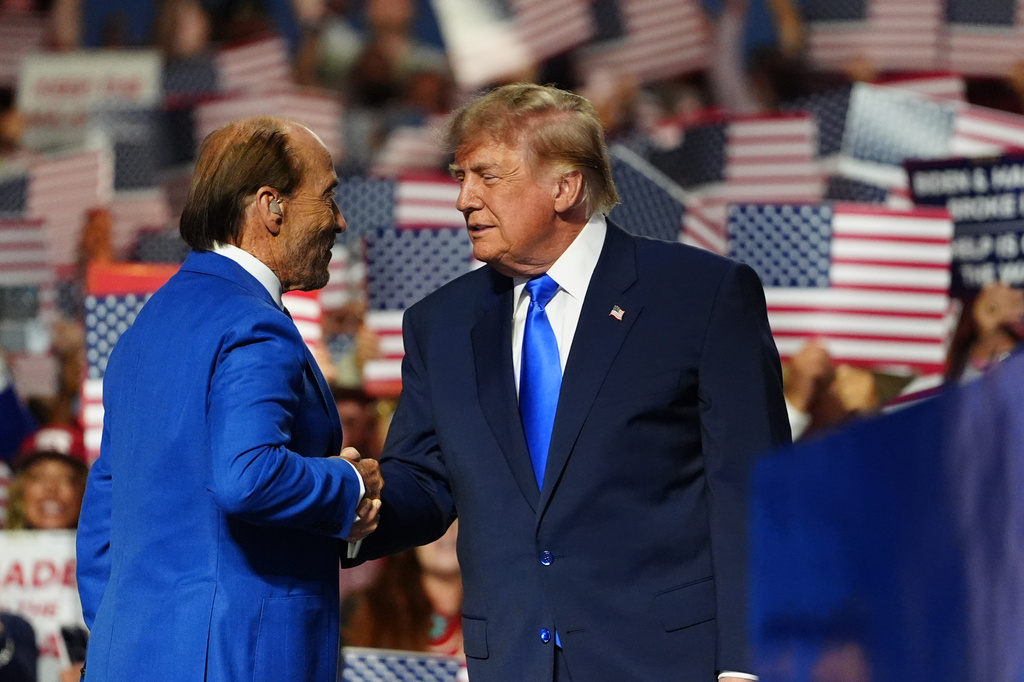 President Donald Trump greets Lee Greenwood at the Republican convention, Wednesday, Sept. 9, 2026, in Dallas. (AP Photo/Julia Demaree Nikhinson)