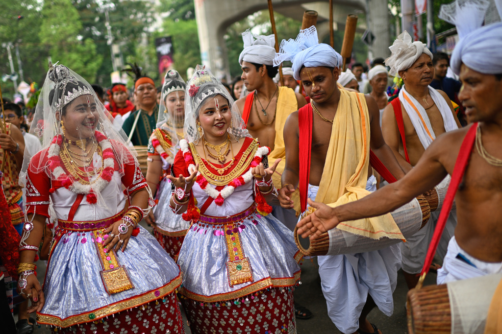 People in their traditional attire participate in the Baishakhi Shobhajatra procession to celebrate the first day of the Bangla New Year in Dhaka, Bangladesh, Tuesday, April 14, 2026. (AP Photo/Mahmud Hossain Opu)
