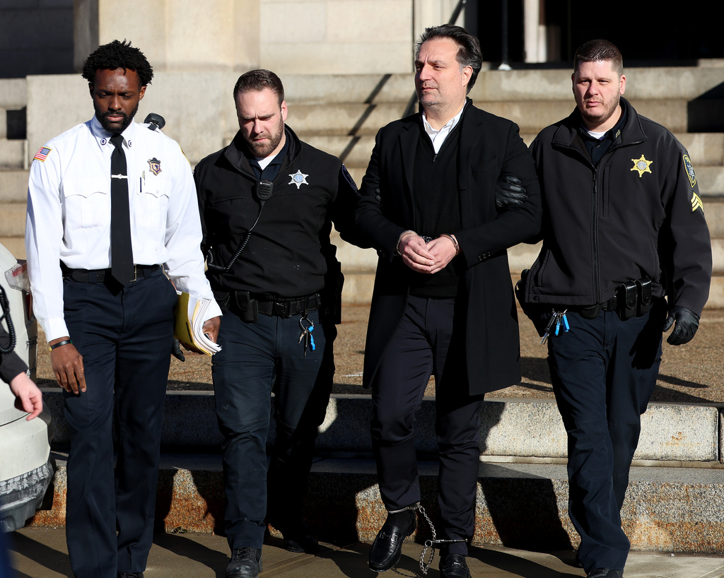 Brian Walshe is brought to a prisoner transport van after he was sentenced in Norfolk Superior Court in Dedham, Mass., on Thursday, Dec. 18, 2025. (Mark Stockwell/Boston Herald via AP, Pool)