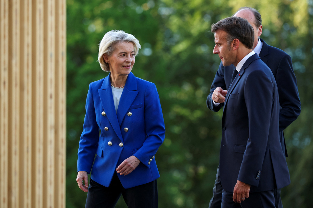 French President Emmanuel Macron walks with European Commission President Ursula von der Leyen during the G7 summit in Evian-les-Bains, France, Monday, June 15, 2026. (Isabel Infantes/Pool Photo via AP)