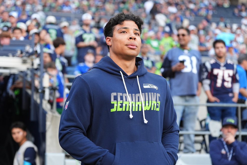 FILE - Seattle Seahawks running back Zach Charbonnet walks out to the field before an NFL football game against the New England Patriots, Sept. 9, 2026, in Seattle. (AP Photo/Lindsey Wasson, File)