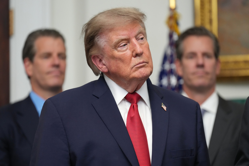 President Donald Trump listens as Gemini co-founder and president Cameron Winklevoss, left, and Gemini co-founder and CEO Tyler Winklevoss, right, watch, during a meeting with technology leaders in the Roosevelt Room of the White House, Wednesday, Aug. 19, 2026, in Washington. (AP Photo/Jacquelyn Martin)