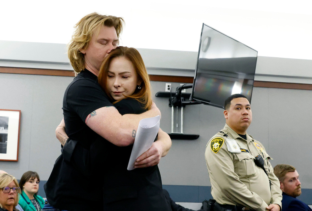 Taylor Probst is hugged by her brother Michael Probst after delivering her victim impact statement during the sentencing of Jesus Ayala and Jzamir Keys for the killing of their father Andreas Probst, Tuesday, Dec. 16, 2025, at the Regional Justice Center in Las Vegas. (Bizuayehu Tesfaye/Las Vegas Review-Journal via AP)