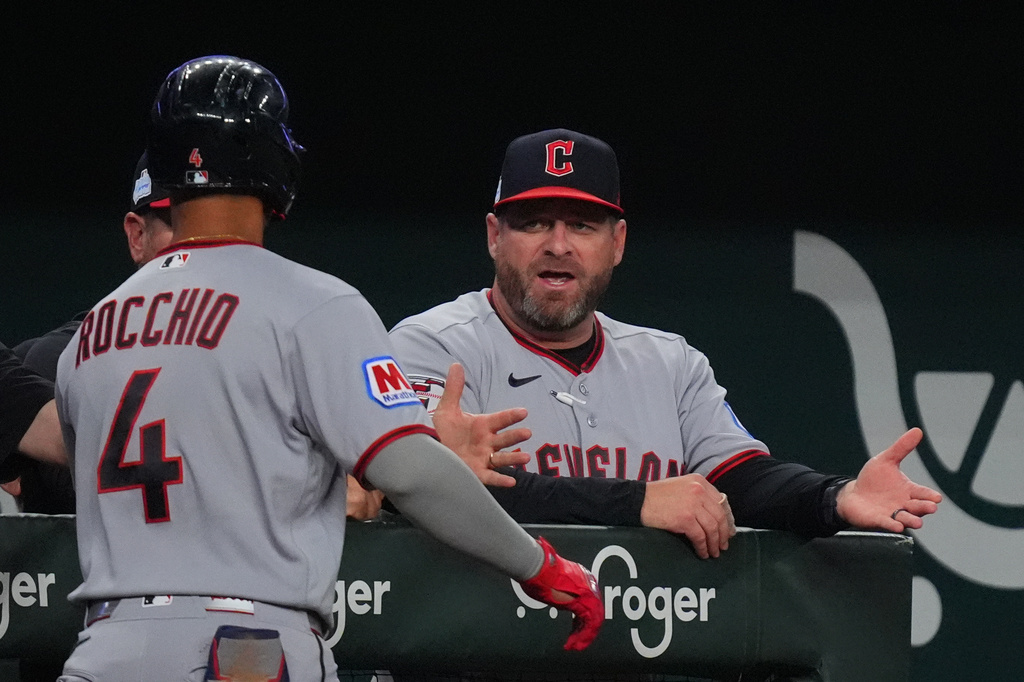 Cleveland Guardians manager Stephen Vogt, right, congratulates Brayan Rocchio (4) after Rocchio hit a home run during the fifth inning of a baseball game against the Texas Rangers, Saturday, June 6, 2026, in Arlington, Texas. (AP Photo/LM Otero)