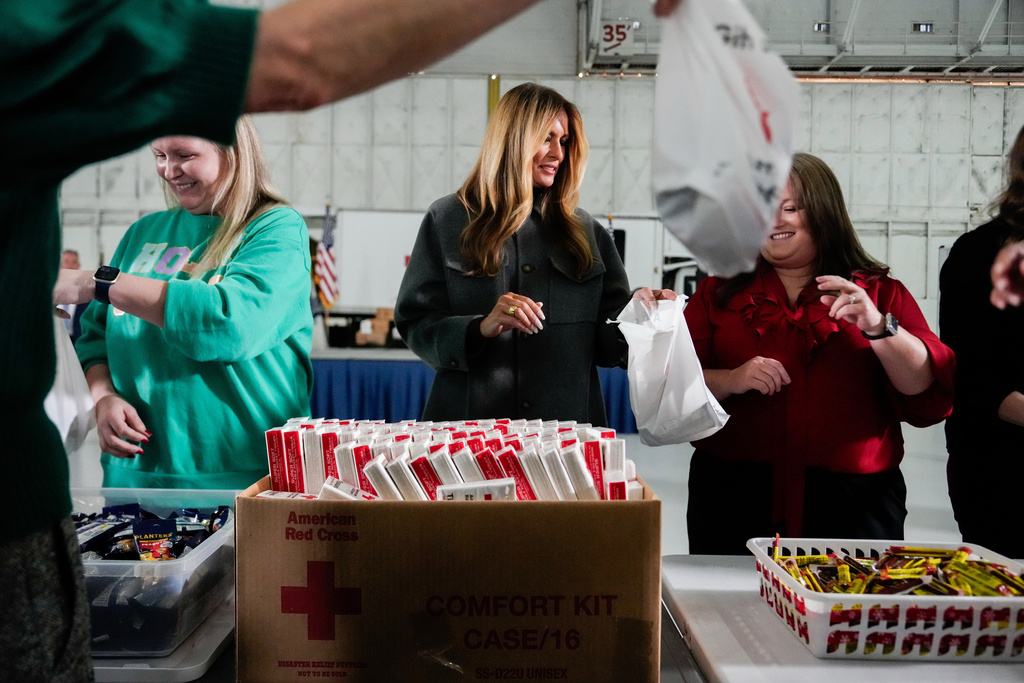 First lady Melania Trump helps build Red Cross holiday care packages, Monday, Dec. 1, 2025, at Joint Base Andrews, Md. (AP Photo/Julia Demaree Nikhinson)