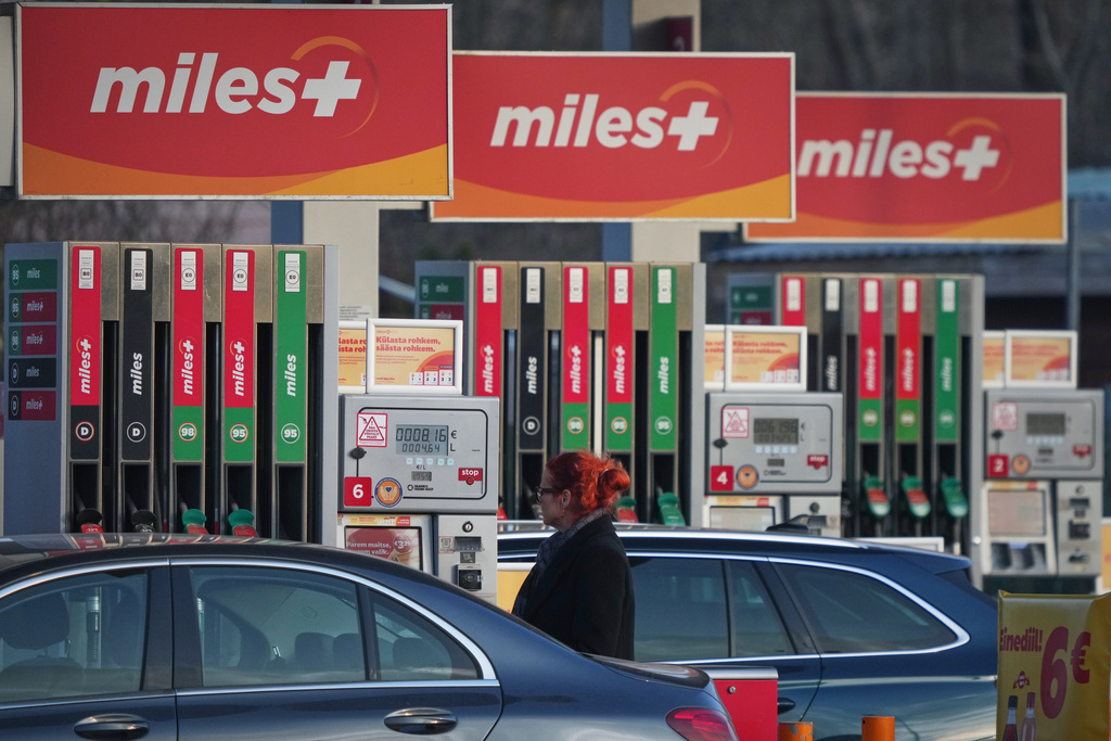 A person fills their vehicle at a gas station in Tallinn, Estonia, Wednesday, March 11, 2026. (AP Photo/Sergei Grits)