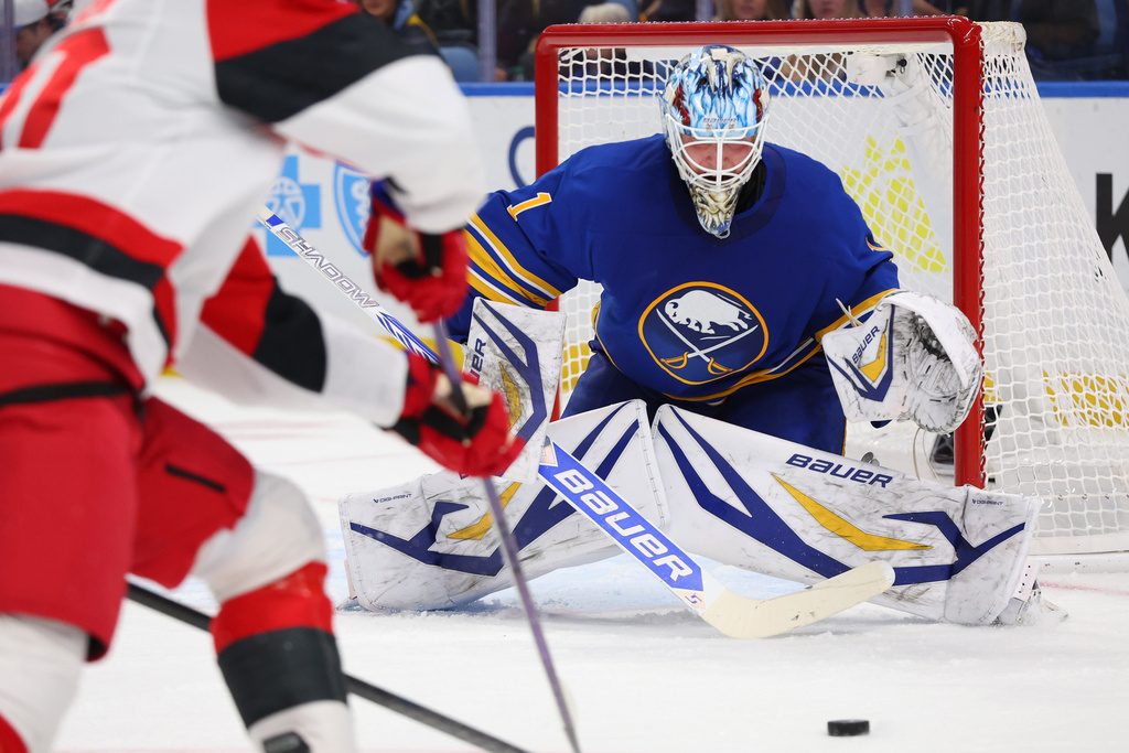 Buffalo Sabres goaltender Ukko-Pekka Luukkonen (1) keeps his eyes on the puck during the second period of an NHL hockey game against the Carolina Hurricanes, Sunday, Nov. 23, 2025, in Buffalo, N.Y. (AP Photo/Jeffrey T. Barnes)