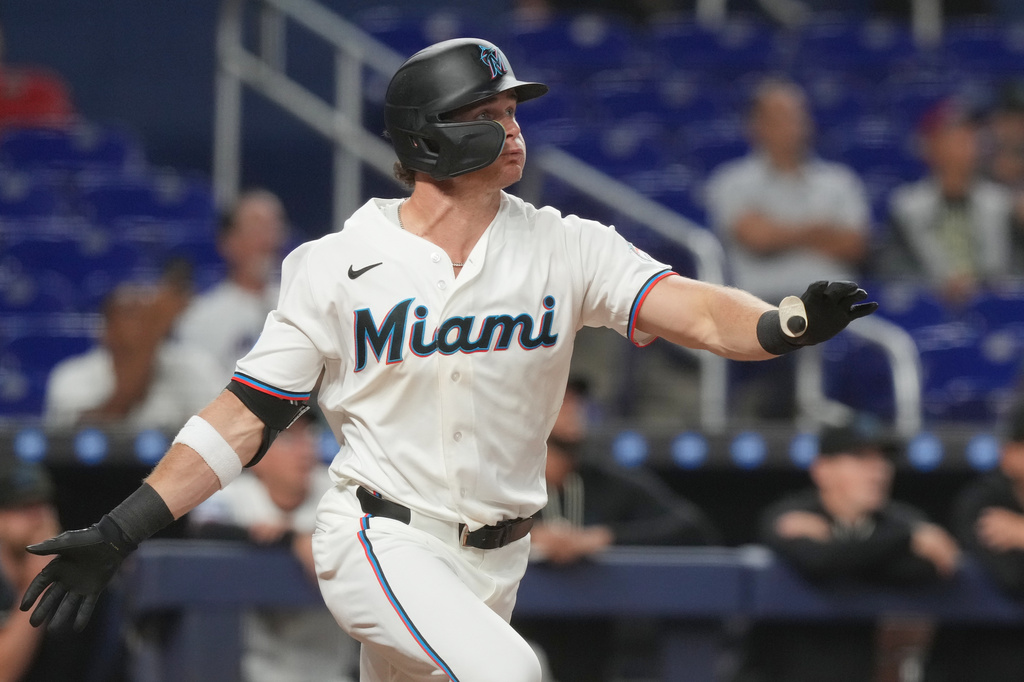 Miami Marlins Griffin Conine hits a two-run home run in the eighth inning during a baseball game against the Chicago White Sox Tuesday, March 31, 2026, in Miami. (AP Photo/Marta Lavandier)