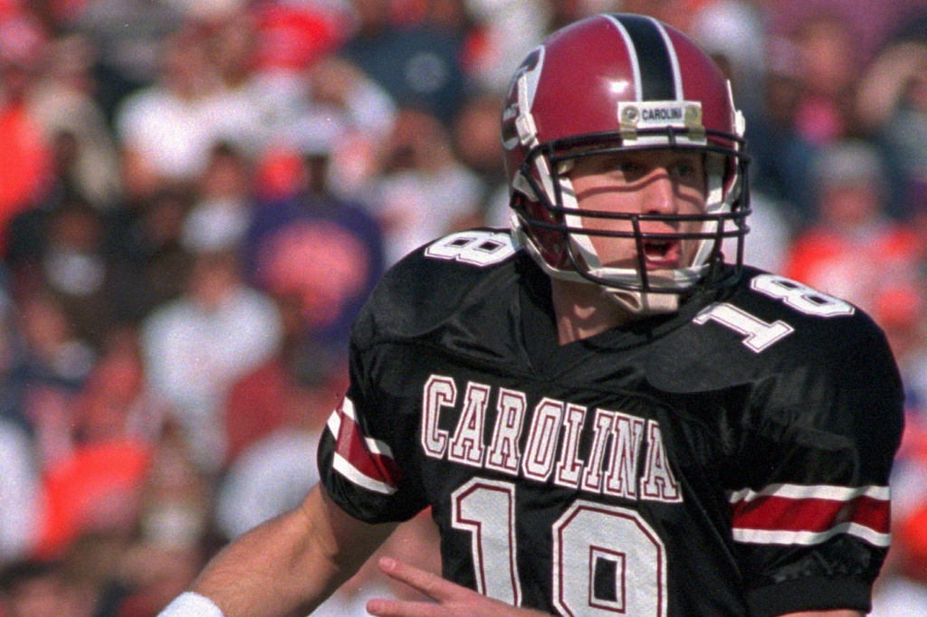 FILE - South Carolina quarterback Steve Taneyhill looks for a receiver during game action against Clemson Saturday, Nov. 18, 1995 at Williams-Brice Stadium in Columbia, S.C. (AP Photo/Lou Krasky, File)