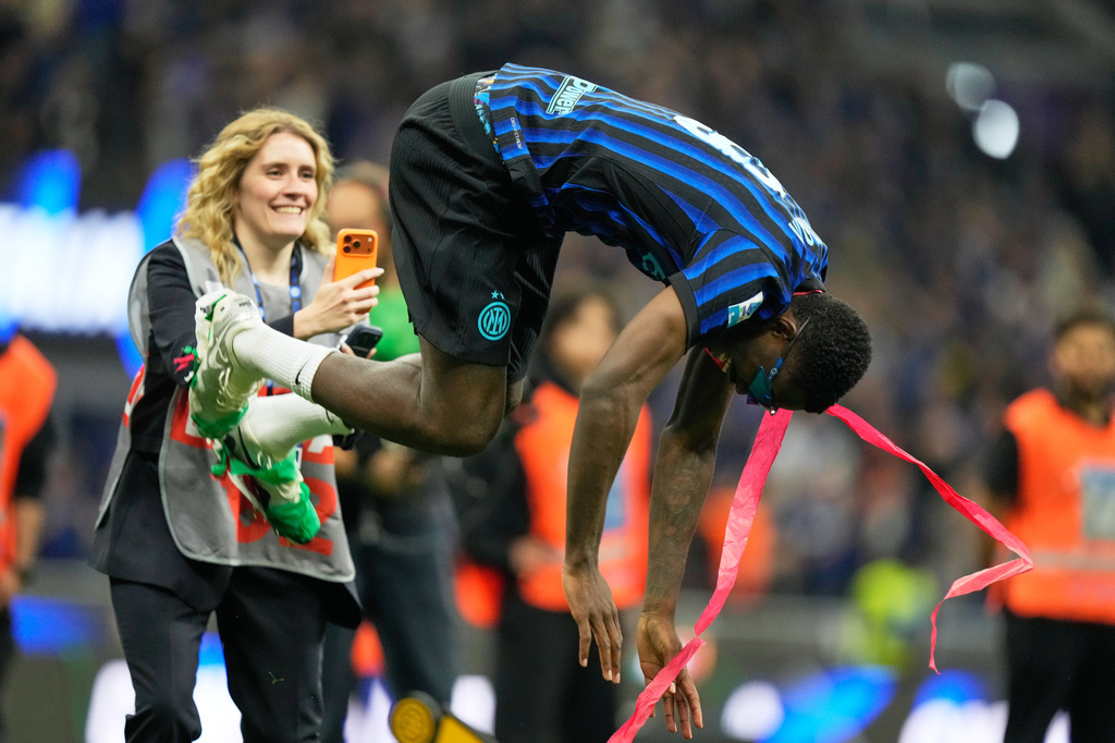 Inter Milan's Marcus Thuram celebrates their victory at the Serie A soccer match between Inter Milan and Parma, in Milan, Italy, Sunday, May 3, 2026. (AP Photo/Luca Bruno)