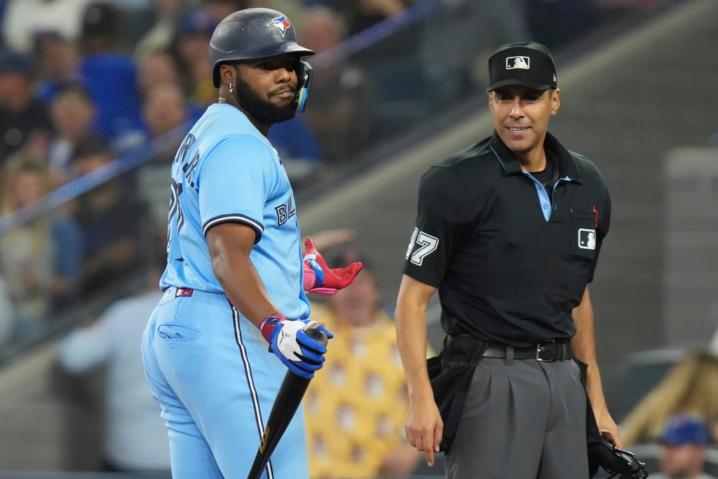 Toronto Blue Jays' Vladimir Guerrero Jr. (27) reacts after being thrown out of the game by Home Plate Umpire Gabe Morales during seventh inning MLB baseball action against the Boston Red Sox in Toronto on Wednesday, Sept. 24, 2025. (Chris Young/The Canadian Press via AP)