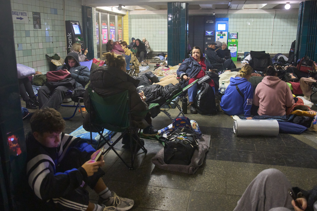 People hide in a subway station during Russia's night missile and drone attack in Kyiv, Ukraine, Saturday, Nov. 29, 2025. (AP Photo/Efrem Lukatsky)