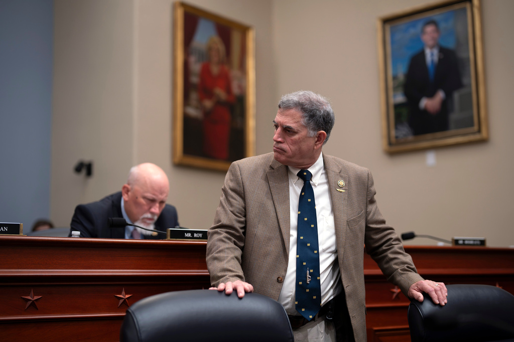 Rep. Andrew Clyde, R-Ga., center, joined by Rep. Chip Roy, R-Texas, left, listens during a markup on the Fiscal Year 2027 spending plan, at the Capitol in Washington, Thursday, July 16, 2026. (AP Photo/J. Scott Applewhite)