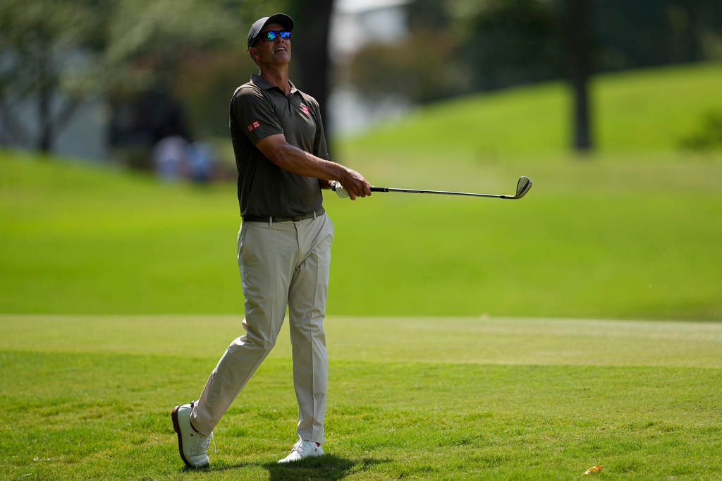 Adam Scott, of Australia, follows his ball to the nineth green during the first round of the St. Jude Championship golf tournament, Thursday, Aug. 13, 2026, in Memphis, Tenn. (AP Photo/George Walker IV)