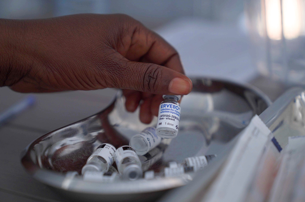 A healthcare worker holds up a vial of the Ervebo vaccine at an Ebola vaccination center in the city of Bunia, Ituri province, Congo, Saturday, Sept. 19, 2026. (AP Photo/Dieudonne Dirole)