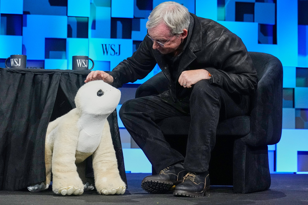 Colin Angle, longtime CEO of Roomba, unveils a four-legged prototype of artificial pet Daphne, called a Familiar, at The WSJ Future of Everything, in New York, Monday, May 4, 2026. (AP Photo/Richard Drew)