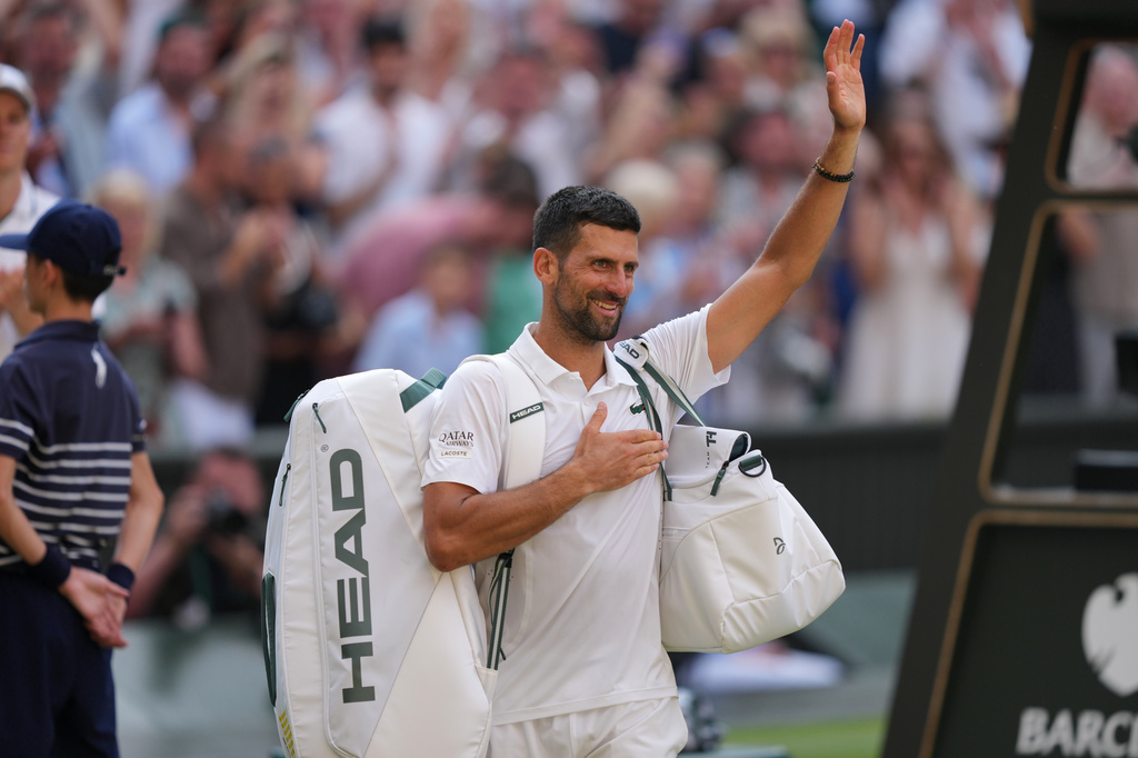 Novak Djokovic of Serbia leaves after losing to Jannik Sinner of Italy in their men's singles semifinal match at the Wimbledon Tennis Championships in London, Friday, July 10, 2026. (AP Photo/Kin Cheung)