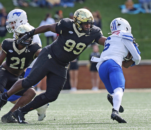 Wake Forest defensive lineman Mateen Ibirogba stops SMU running back Chris Johnson Jr. during an NCAA college football game, Saturday, Oct. 25, 2025, in Winston-Salem, N.C. (Walt Unks/The Winston-Salem Journal via AP) Wake Forest defensive lineman Mateen Ibirogba stops SMU running back Chris Johnson Jr. during an NCAA college football game, Saturday, Oct. 25, 2025, in Winston-Salem, N.C. (Walt Unks/The Winston-Salem Journal via AP)