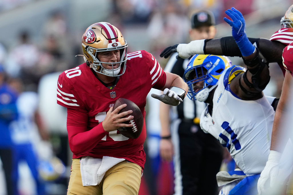 San Francisco 49ers quarterback Mac Jones (10) scrambles against the Los Angeles Rams during the second half of an NFL football game in Santa Clara, Calif., Sunday, Nov. 9, 2025. (AP Photo/Godofredo A. Vásquez)